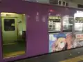 於日本嵐電的高捷少女彩繪電車