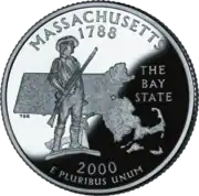 A nickle coin bearing the statue of a man in 18th-century clothing. He holds a rifle, and his coat is on a plow beside him. Behind the man is the outline of Massachusetts. Above the image is inscribed "Massachusetts" and "1788." Beside the image is inscribed "The Bay State." Below the image is inscribed "2000" and "E pluribus unum".