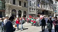 Photograph of people walking on a street protesting against Armenian claims of genocide