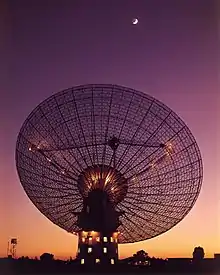 Satellite dish pointing towards the Moon