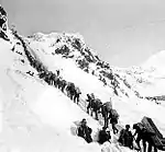 Klondikers carrying supplies ascending the Chilkoot Pass, 1898.