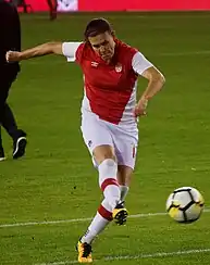 Sinclair warms up before an international friendly in November 2017