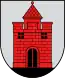 A coat of arms depicting a red castle with black double doors, two black windows, and one central tower all standing on black ground