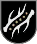 A coat of arms depicting six yellow stars in a diagonal line running from the bottom left to the top right all on a black background