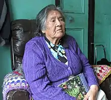 A photo of Cristina Calderón in 2013, sitting in a chair