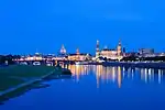 Several Baroque buildings in Dresden old town, reflected in the River Elbe.