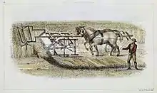 man guiding two horses pushing machine