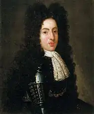 A 19 year-old man wears a black suit of armour and peri-wig.