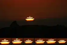 Mock mirage sunset with green flash