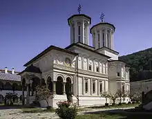 A richly ornamented church building with two bell towers