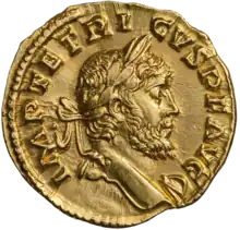 The obverse of a golden coin showing the face of Tetricus.