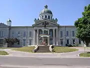 Exterior view of front facade of Frontenac County Court House and fountain