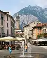 Piazza XX Settembre, in the centre of the town, and the San Martino mountain.