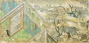 A house, trees with white blossoms and people.