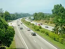 A dual highway with greenery on either side