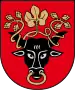 A coat of arms depicting the black head of a bull with a golden vine entangled in its black horns and a golden ring protruding from its nose