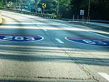 Interstate Shields for I-283 and I-83 painted on the roadway.