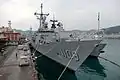 2017年敦睦遠航訓練支隊訪問基隆，停泊東五號碼頭的張騫軍艦（左）與西寧軍艦（PFG-1203，右）。攝於磐石軍艦（AOE-532）艦尾直升機甲板右舷。