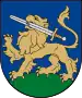 A coat of arms depicting a golden lion holding a silver-bladed sword in its mouth with a golden hilt and standing on green turf all on a blue background