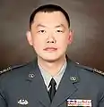 著陸軍軍常服的士官（莊起瑞一等士官長）