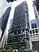 Ground-level view of a 31-storey building with a glass facade