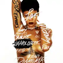 Rihanna's nude body covered in graffiti-style words such as "Victory" and "Fearless"