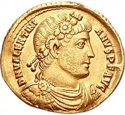 Gold coin depicting man with diadem facing right